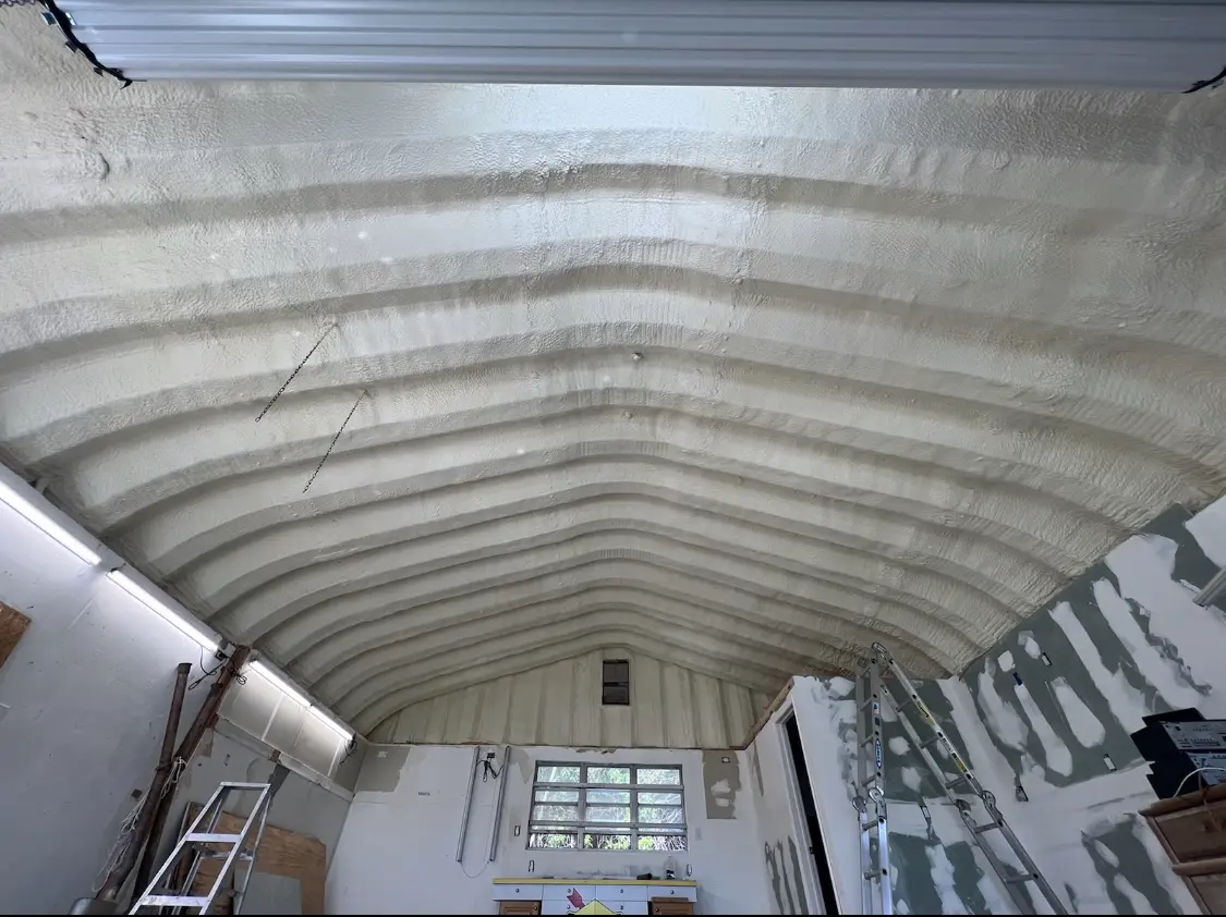 Spray polyurethane foam applied to the underside of a metal roof deck in Minneapolis
